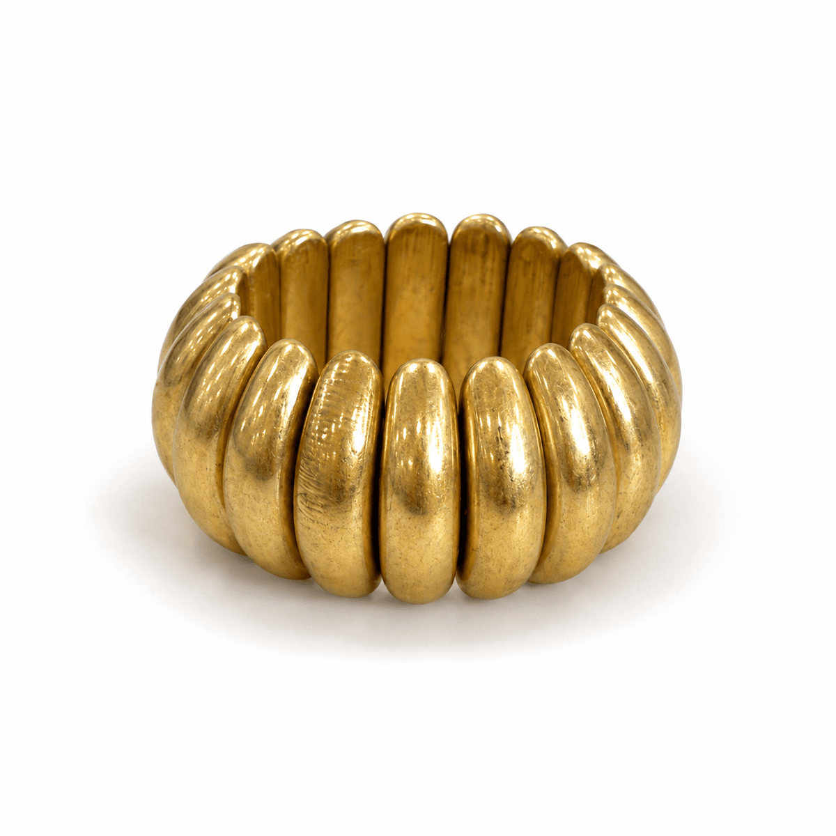Wide metal bracelet on a stretch band in vintage gold