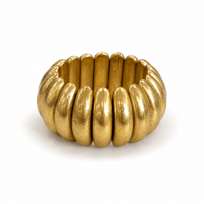 Wide metal bracelet on a stretch band in vintage gold