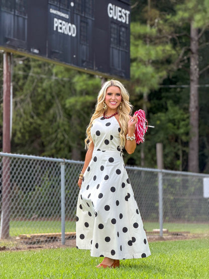 Black polka dots on a cream high neck midi dress