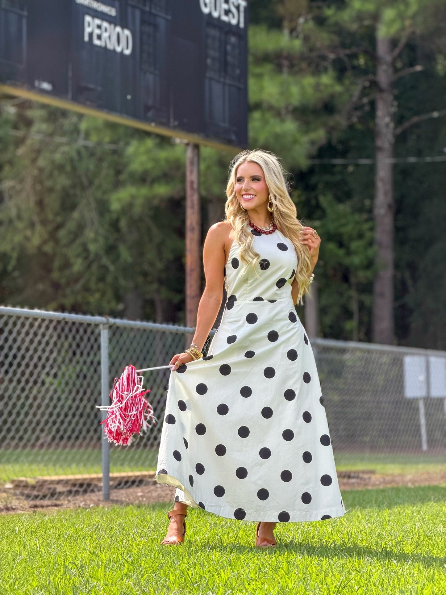 Spotted cream dress falling to a midi length