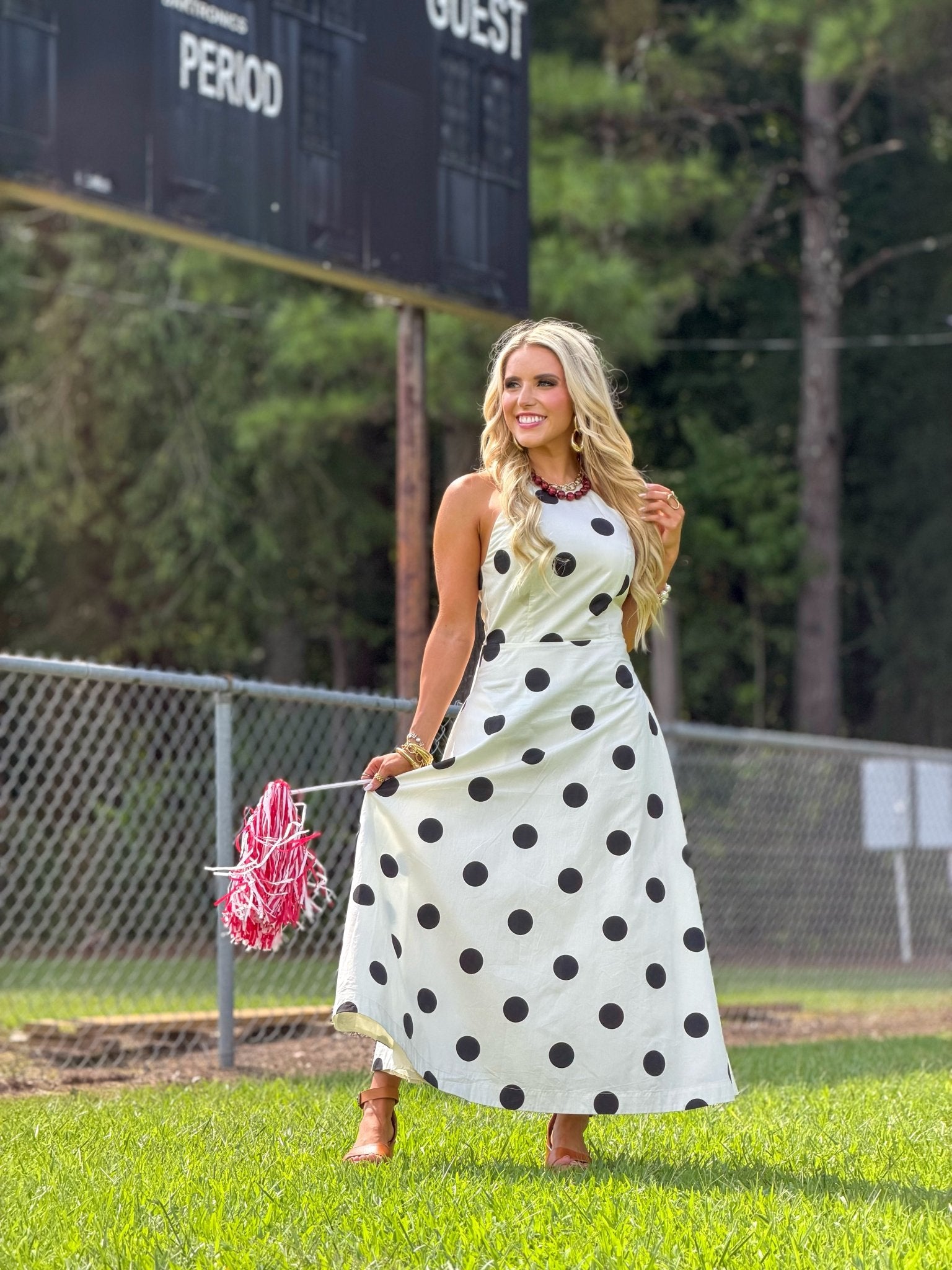 Spotted cream dress falling to a midi length