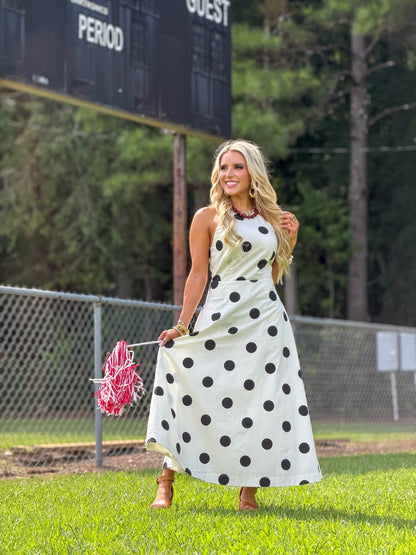 Spotted cream dress falling to a midi length
