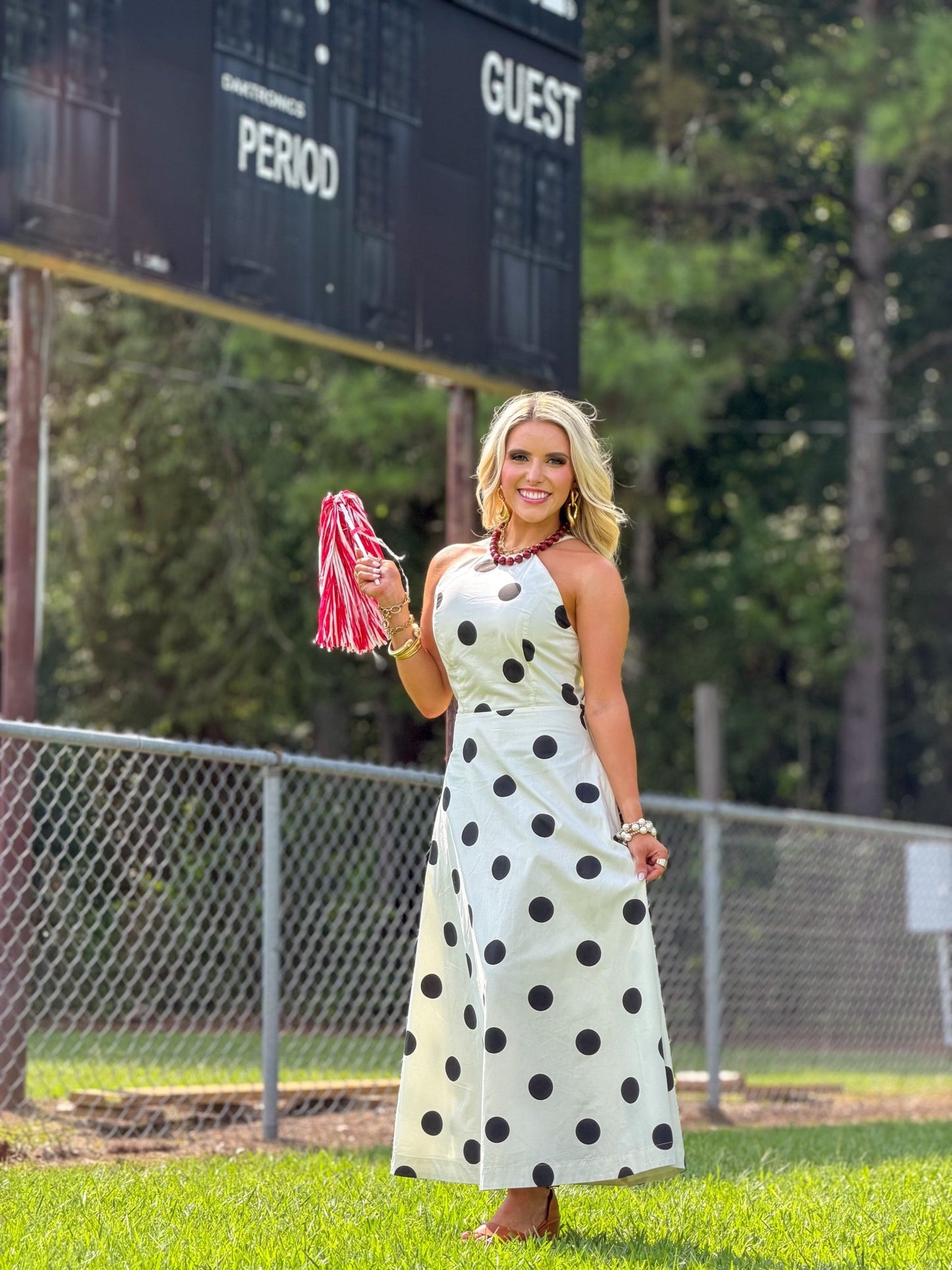 High neckline on a cream polka dot midi dress